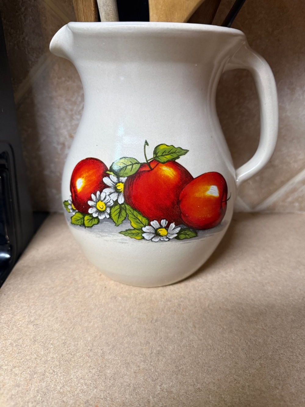 Shakers & Thangs Cream Ceramic Pitcher with Red Apple Design